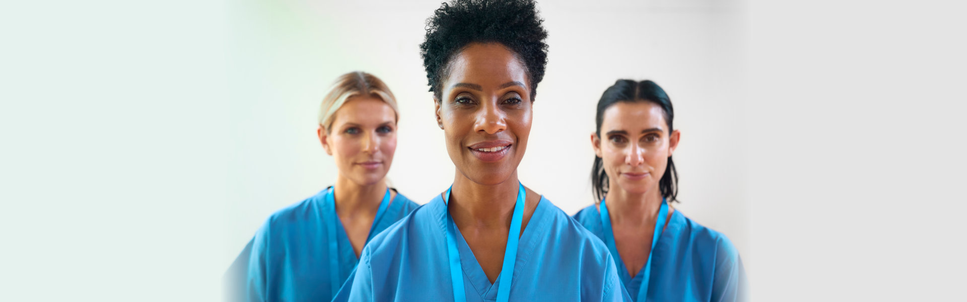 Three medical person smiling
