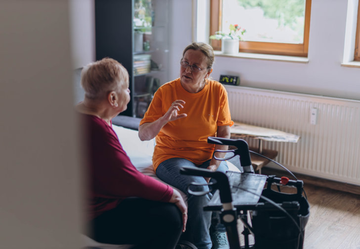 Caretaker caring for an elderly person