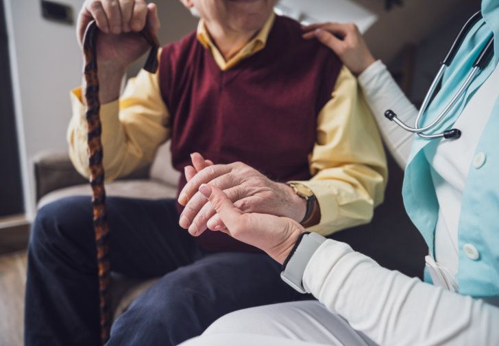 Caretaker caring for an elderly person